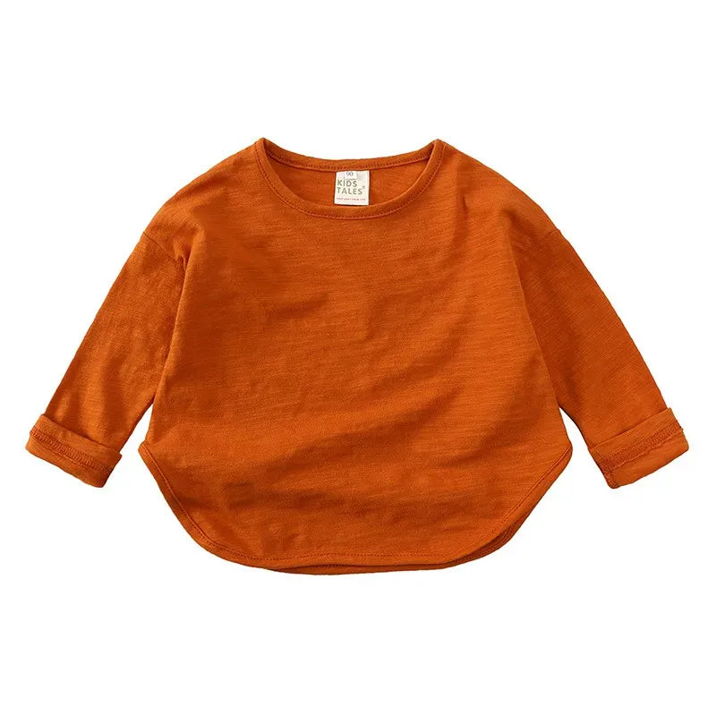 キッズ用長袖Tシャツ テラコッタオレンジの無地ラウンドネック