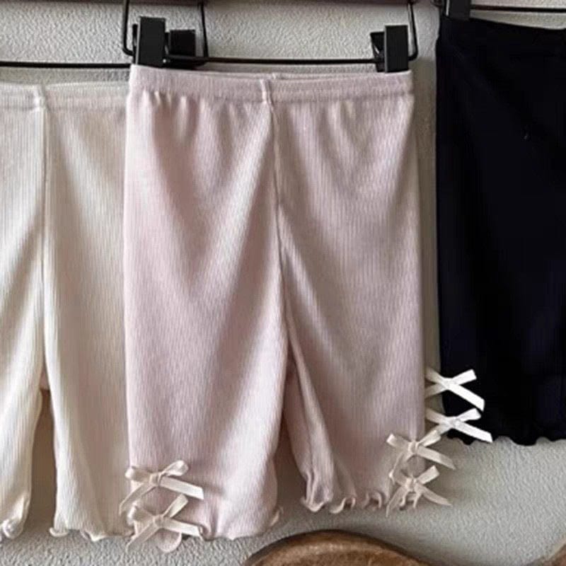 ショートレギンスパンツ、ピンク系の裾サイドリボン結び付き