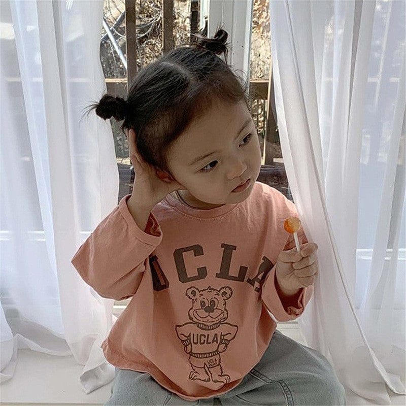 キッズ用長袖Tシャツ(オレンジ)くまプリントのトップス