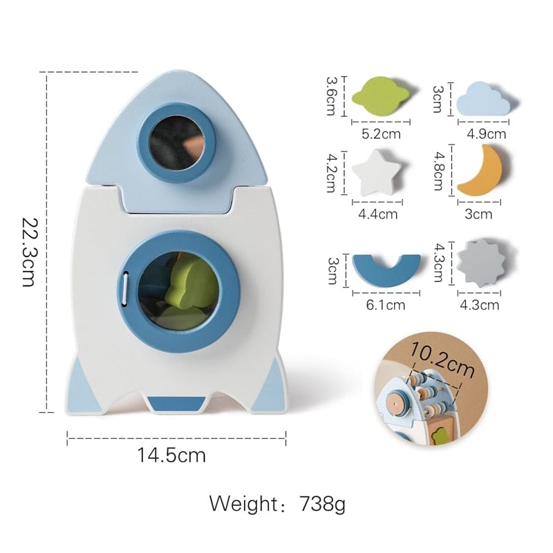 木製ロケットおもちゃのサイズ図。青い丸窓と星・月のパーツ形状