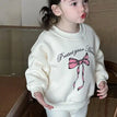 white bow fleece top