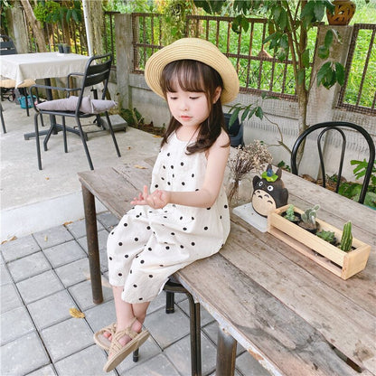 黒ドットの生成りワイドサロペット、かぶり式で裾が広いデザイン