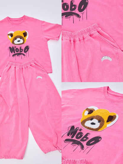 ピンクのフロッキープリントアライグマ柄半袖Tシャツとワイドパンツのセット