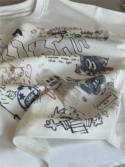 クリーム色半袖Tシャツ、落書き風グラフィック部分のアッププリント