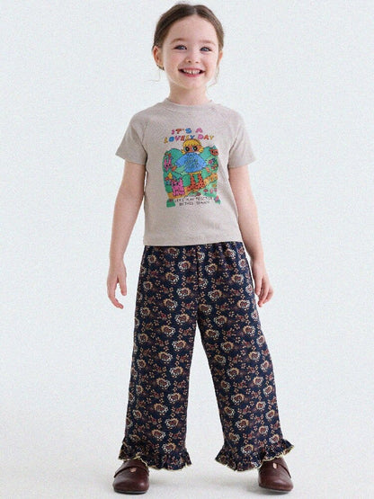 グレー系のキャラクタープリント子どもラグランTシャツ（前面）