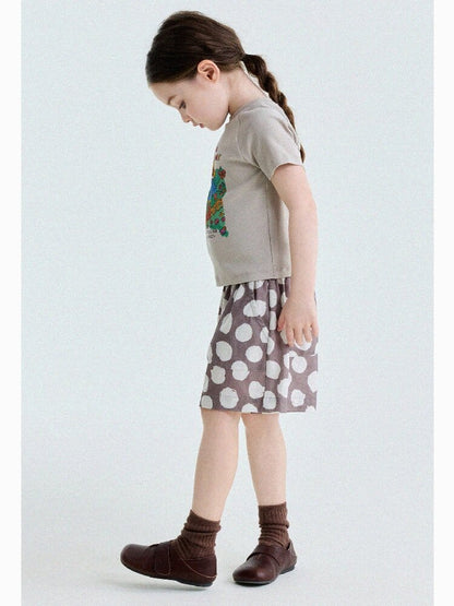 子ども用ラグランTシャツ　ベージュ地のキャラクタープリント、横姿