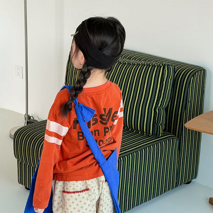 グラフィックプリント長袖Tシャツ（オレンジ）背面の英字ロゴと袖のライン