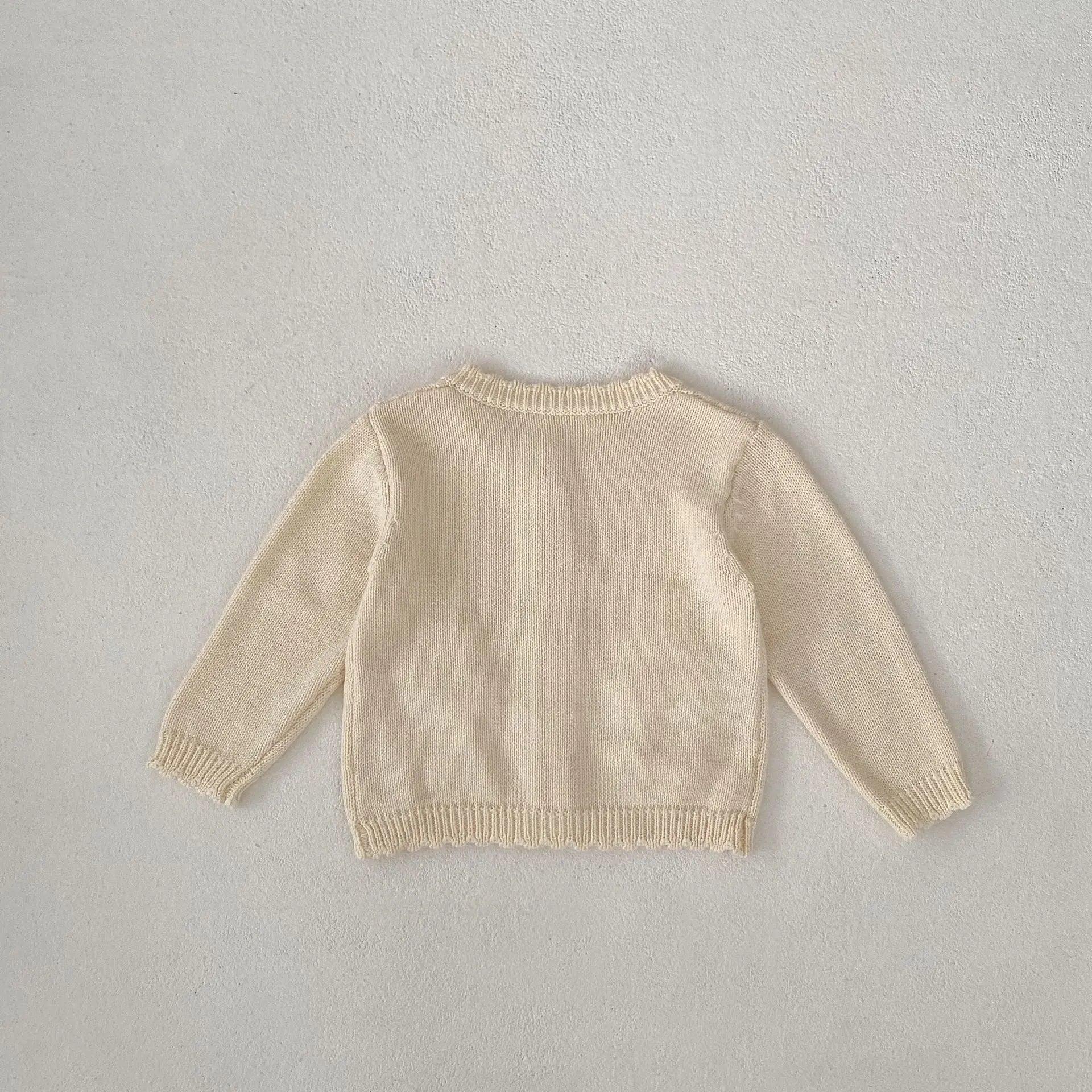 カーディガン・パーカー ベビーカーディガン ニットジャケット フラワーアップリケ アプリコットホワイト