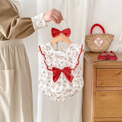 ノースリーブロンパース ベビーロンパース ヘアバンドセット ノースリーブリボンフリルボディスーツ