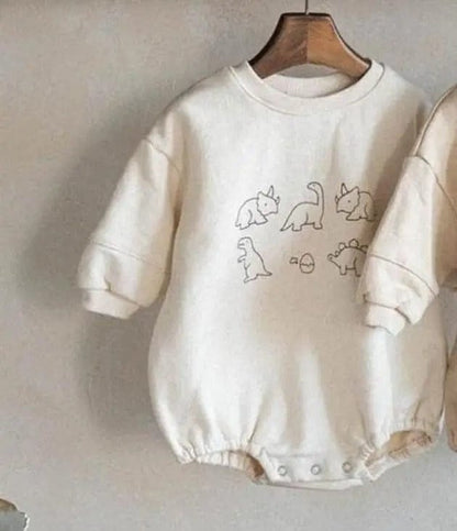 長袖ロンパース beige / 6M  66cm / 取り寄せ（7〜30日） ベビーロンパース ダイナソー恐竜プリント長袖ボディスーツ 2カラー