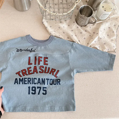 青のキッズ長袖Tシャツ、LIFE TREASURl AMERICANTOUR 1975ロゴプリント