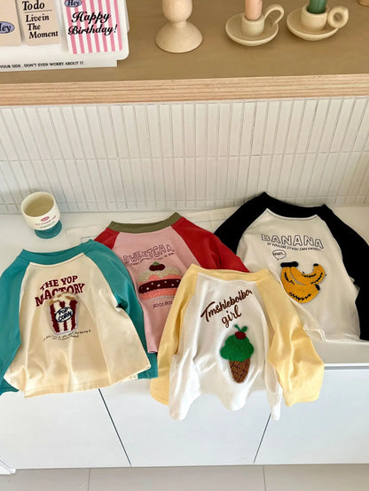 長袖Tシャツ キッズトップス 長袖Tシャツ ロンT ラグランパッチワーク ポップコーンケーキバナナ刺繍 4カラー