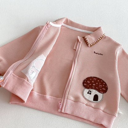 ピンクのワッフル風ジップアップジャケット きのこモチーフと前面刺繍