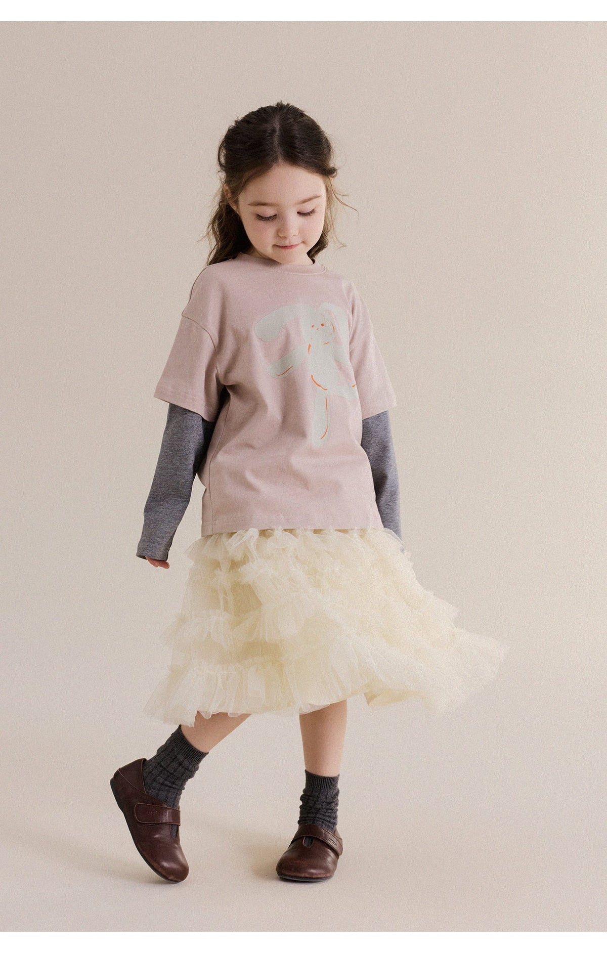 ピンクのキッズ長袖風Tシャツ、淡い動物プリント