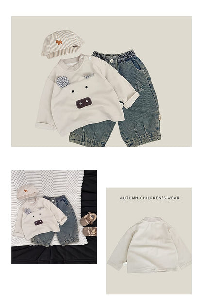 長袖Tシャツ オフホワイト系、胸にチェック柄の目と動物風アップリケ