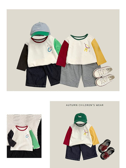 ベビー用長袖カラーブロックTシャツ、白地に緑と黒の袖切替と動物刺繍風プリント