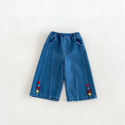 キッズ デニムパンツ 両裾にカラフル刺繍とボタン装飾付き